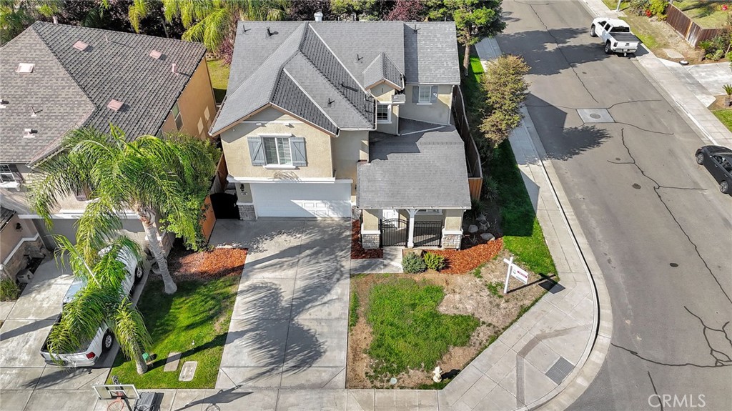 692 Blueberry Lane Madera, CA 93638 - Photo 41 of 44 an aerial view of a house with garden space and street view