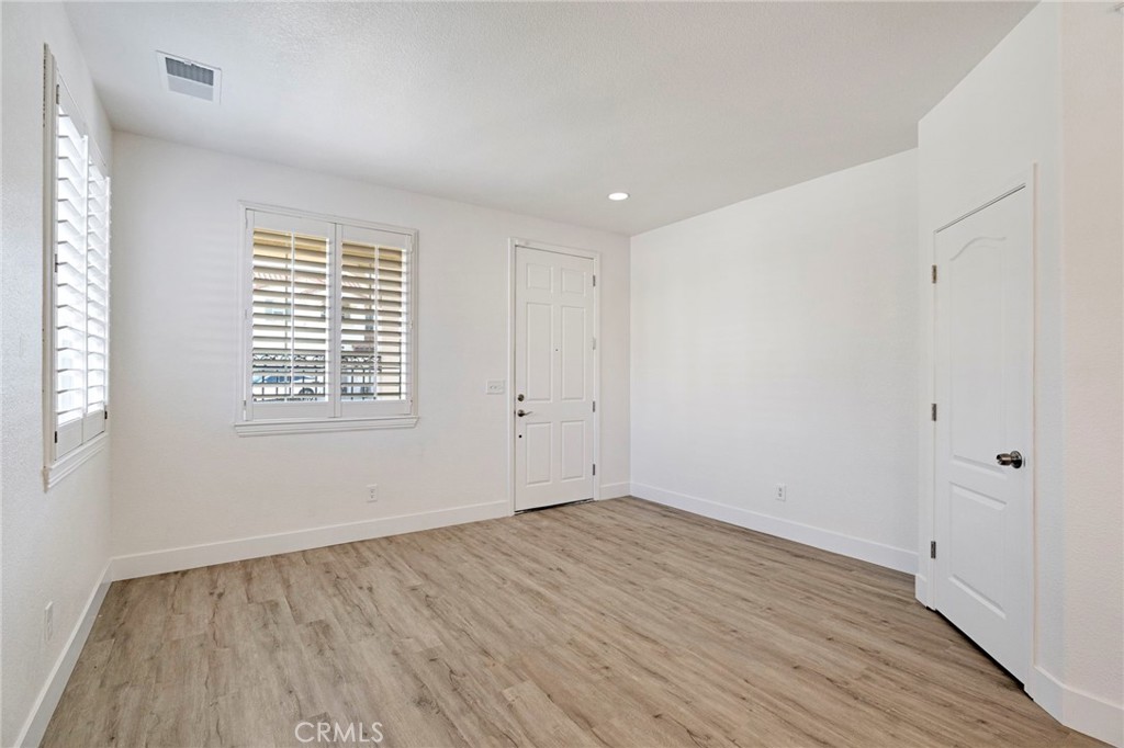 692 Blueberry Lane Madera, CA 93638 - Photo 5 of 44 wooden floor in an empty room with a window