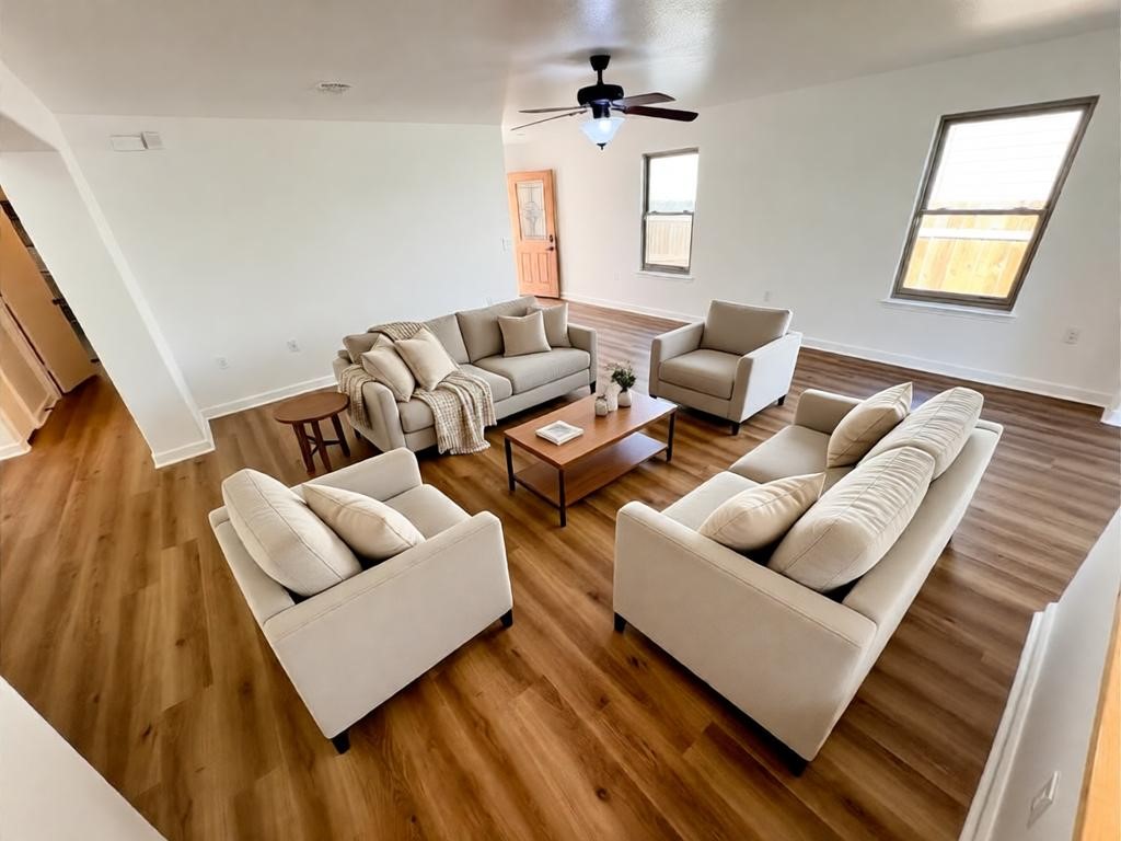 8003 Bannock Lane Austin, TX 78747 - Photo 5 of 40 The living area features light-toned flooring, white walls, and a ceiling fan with integrated lighting