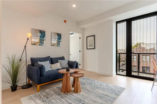 a living room with furniture and a window