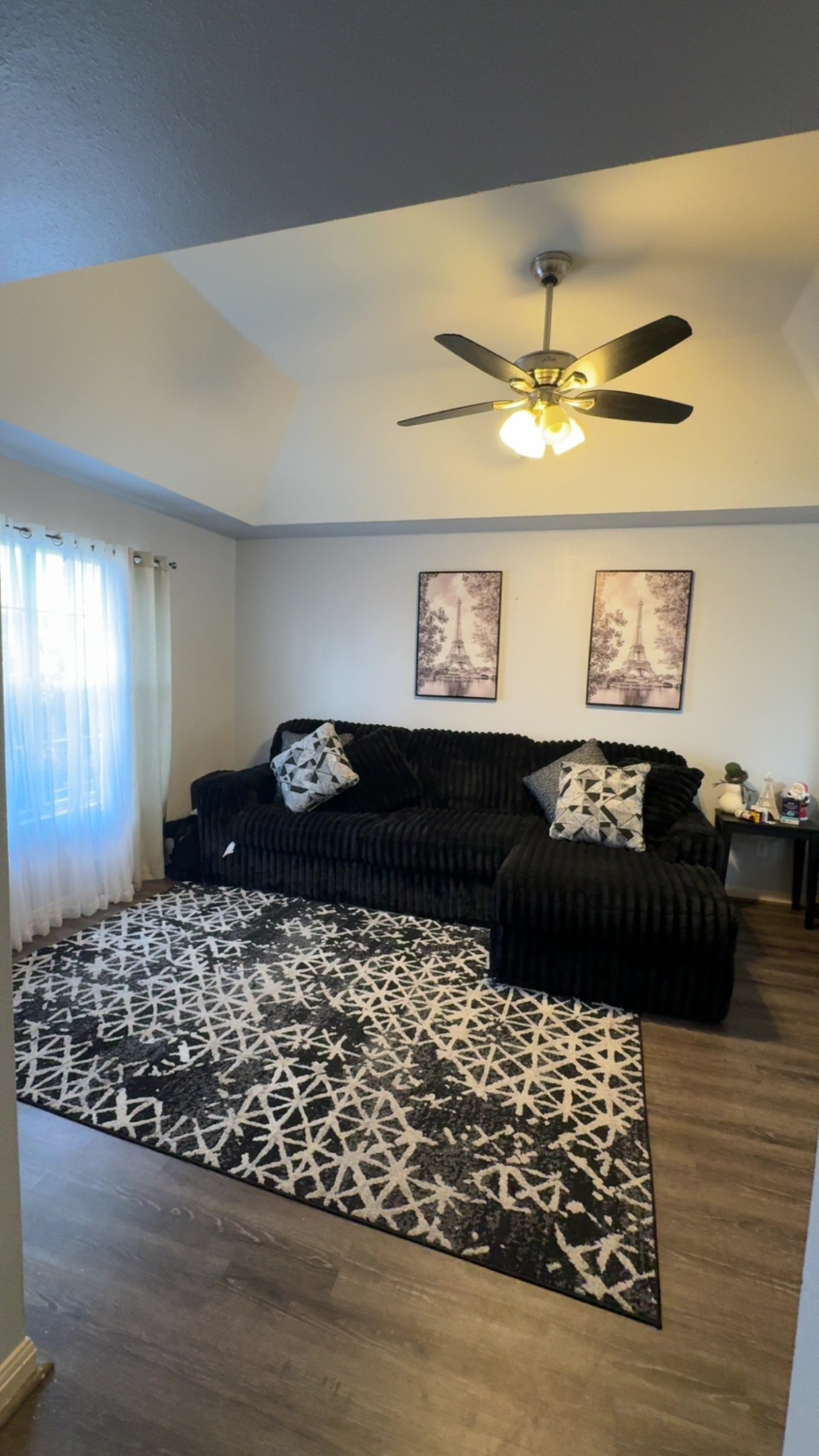 310 Raintree Drive Georgetown, TX 78626 - Photo 2 of 8 a living room with a couch and wooden floor