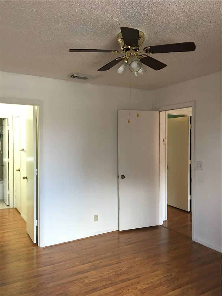 8422 Southwest 44th Place Davie, FL 33328 - Photo 13 of 16 a view of an empty room with wooden floor