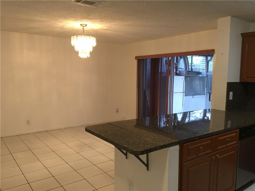 8422 Southwest 44th Place Davie, FL 33328 - Photo 3 of 16 a kitchen with a counter space and a window