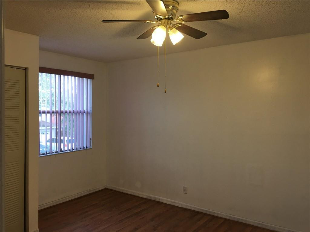 8422 Southwest 44th Place Davie, FL 33328 - Photo 7 of 16 an empty room with a window and a fan
