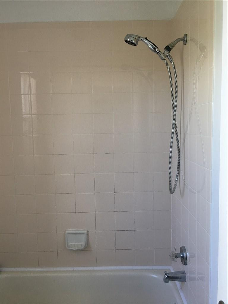 8422 Southwest 44th Place Davie, FL 33328 - Photo 10 of 16 a bathroom with a shower and a bathtub