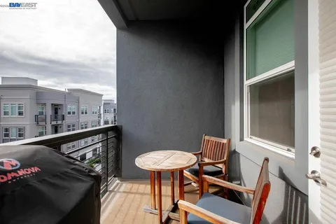 a view of a building with a lot of trees and plants