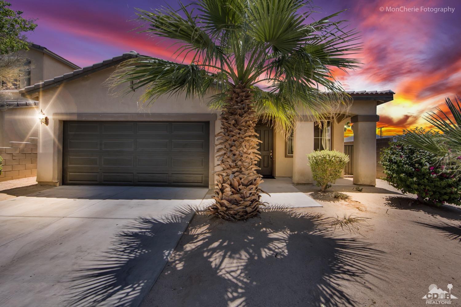 82903 Corte Lucia Indio, CA 92201 - Photo 1 of 26 a front view of a house with a yard and garage