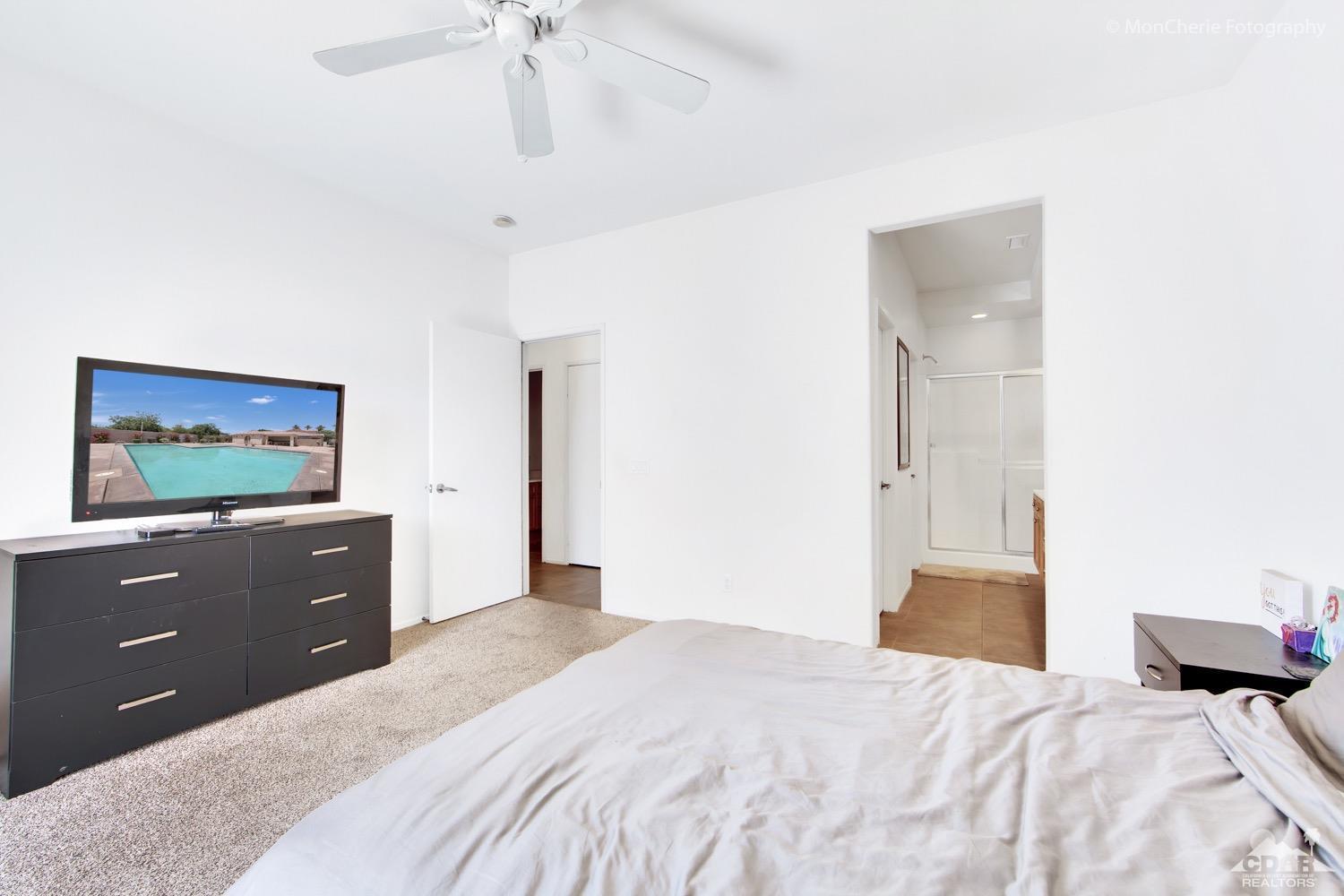 82903 Corte Lucia Indio, CA 92201 - Photo 14 of 26 a bedroom with a bed and a dresser