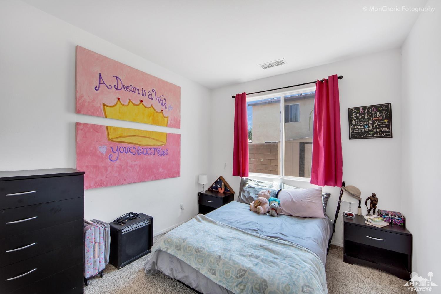 82903 Corte Lucia Indio, CA 92201 - Photo 17 of 26 a bedroom with a bed and dresser