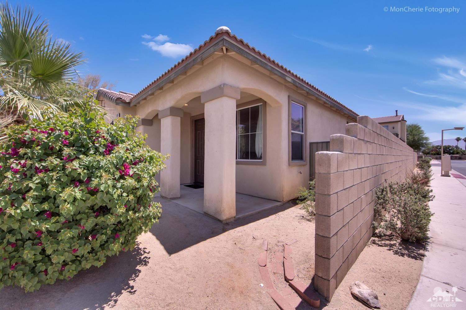82903 Corte Lucia Indio, CA 92201 - Photo 22 of 26 a front view of a house with a yard