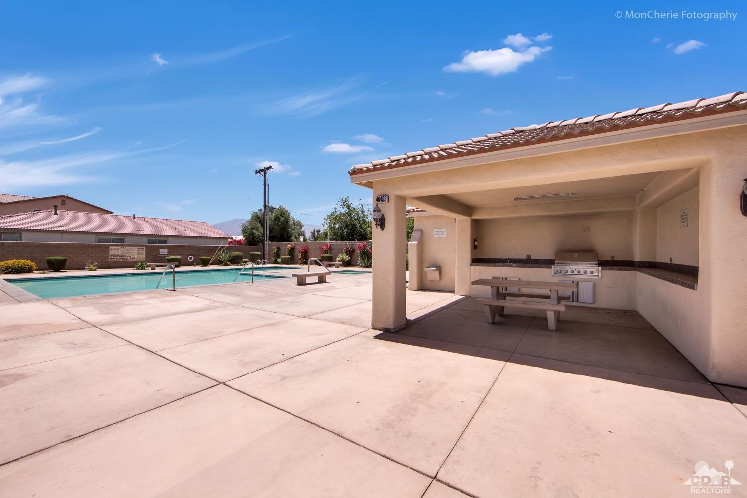 82903 Corte Lucia Indio, CA 92201 - Photo 24 of 26 a view of a patio with table and chairs