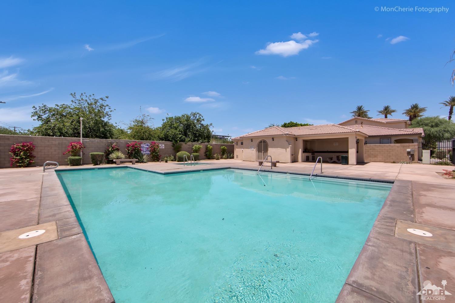 82903 Corte Lucia Indio, CA 92201 - Photo 25 of 26 a front view of a house with a yard