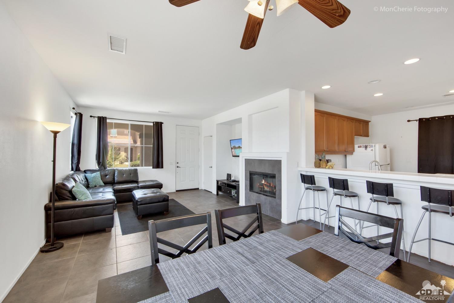 82903 Corte Lucia Indio, CA 92201 - Photo 4 of 26 a living room with furniture fireplace and rug
