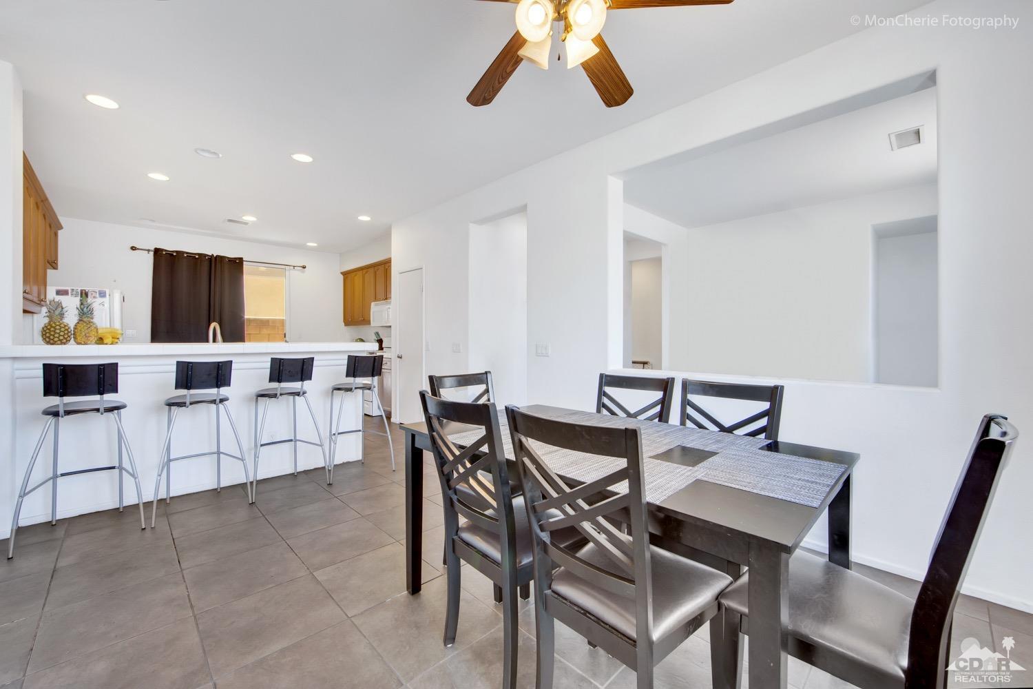 82903 Corte Lucia Indio, CA 92201 - Photo 5 of 26 a view of a dining room with furniture