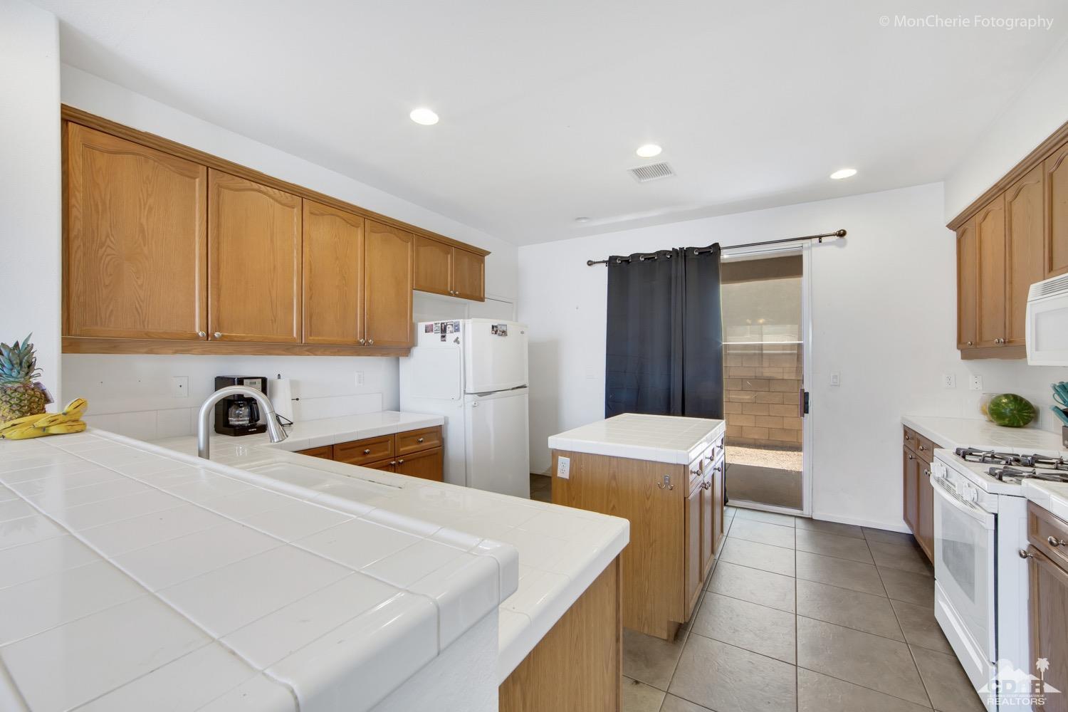 82903 Corte Lucia Indio, CA 92201 - Photo 7 of 26 a room with storage and utility