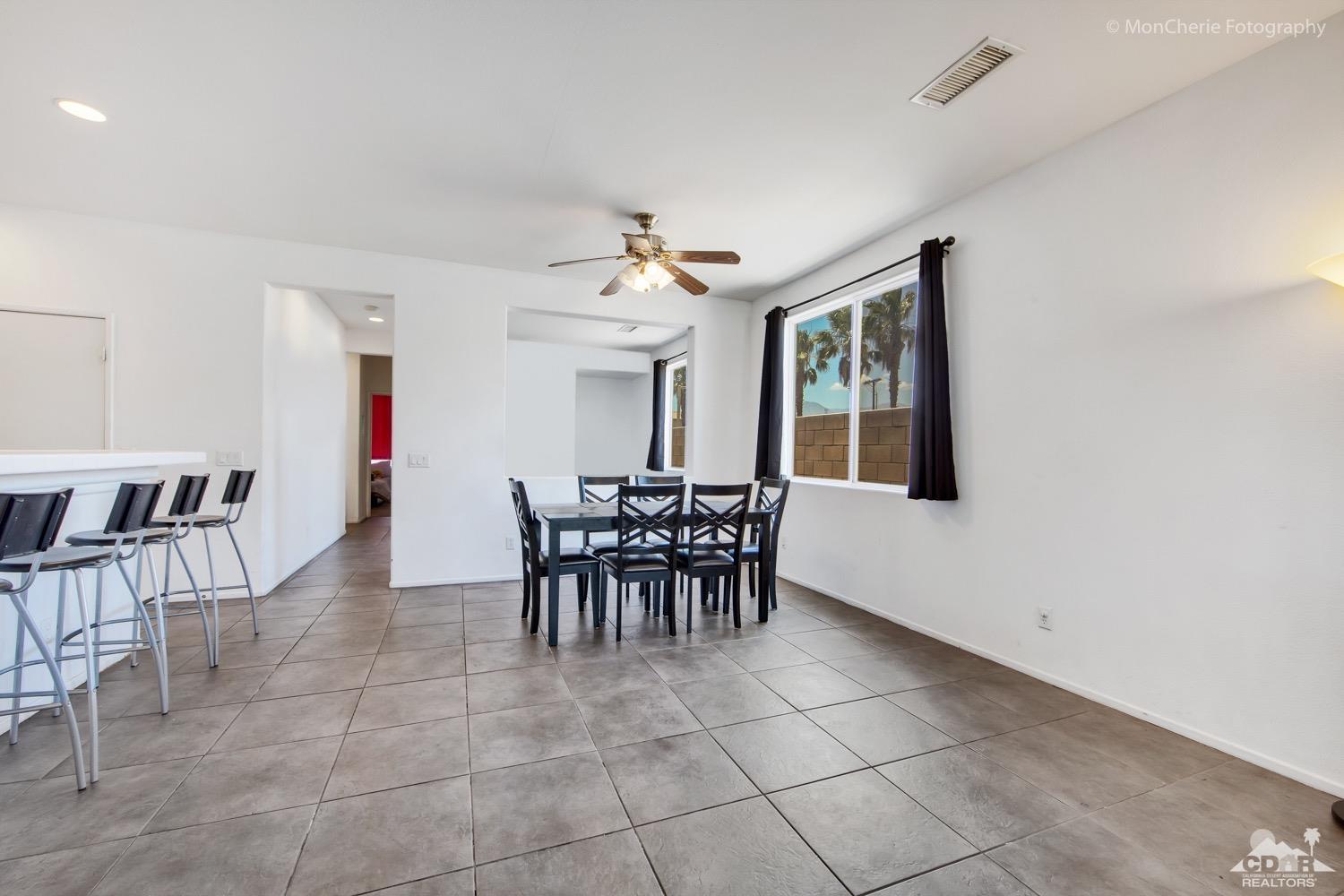82903 Corte Lucia Indio, CA 92201 - Photo 10 of 26 a view of a dining room with furniture and window