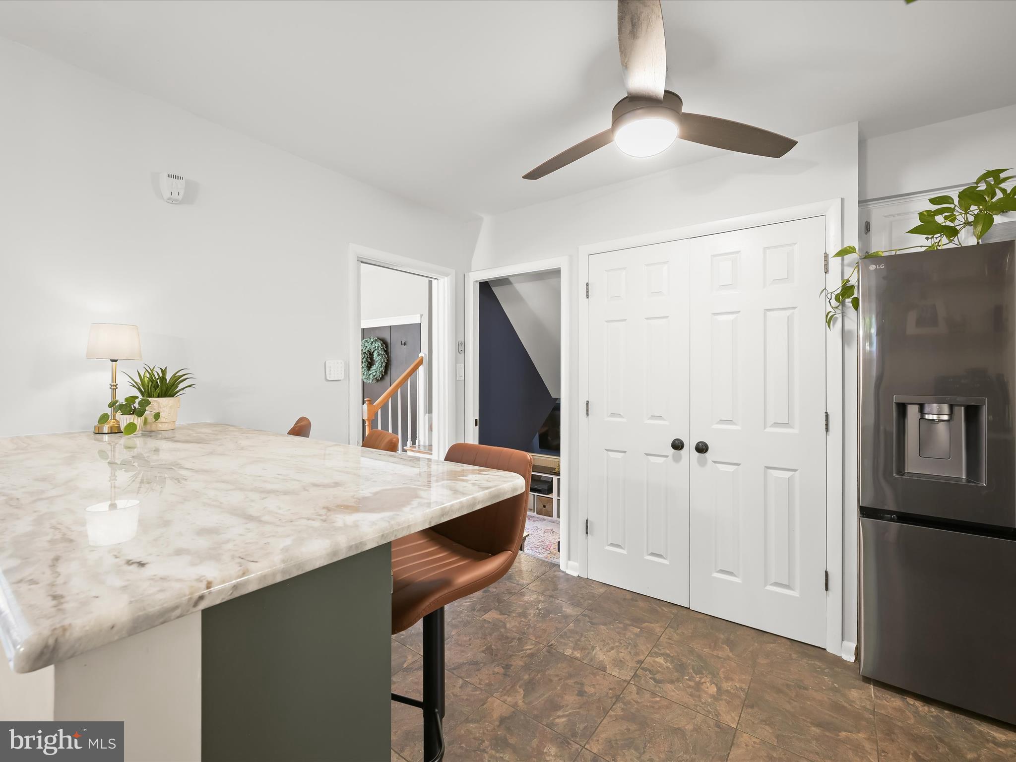 1910 Rollingwood Road Catonsville, MD 21228 - Photo 15 of 40 a view of kitchen island with cabinets and wooden floor