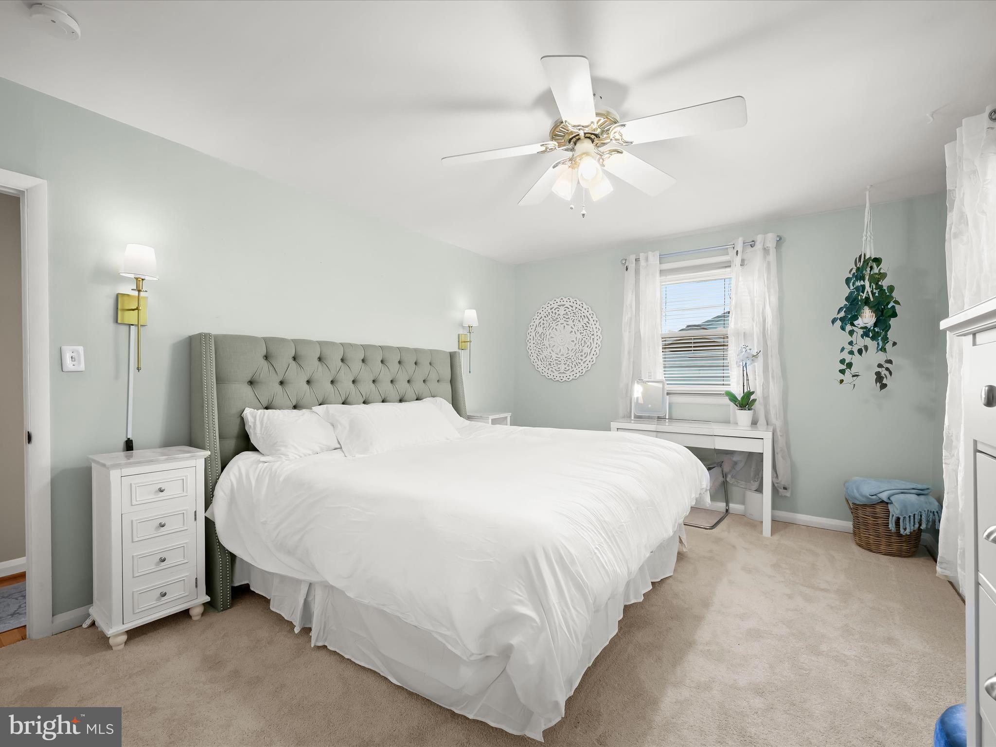 1910 Rollingwood Road Catonsville, MD 21228 - Photo 18 of 40 a bedroom with a large bed and a chandelier