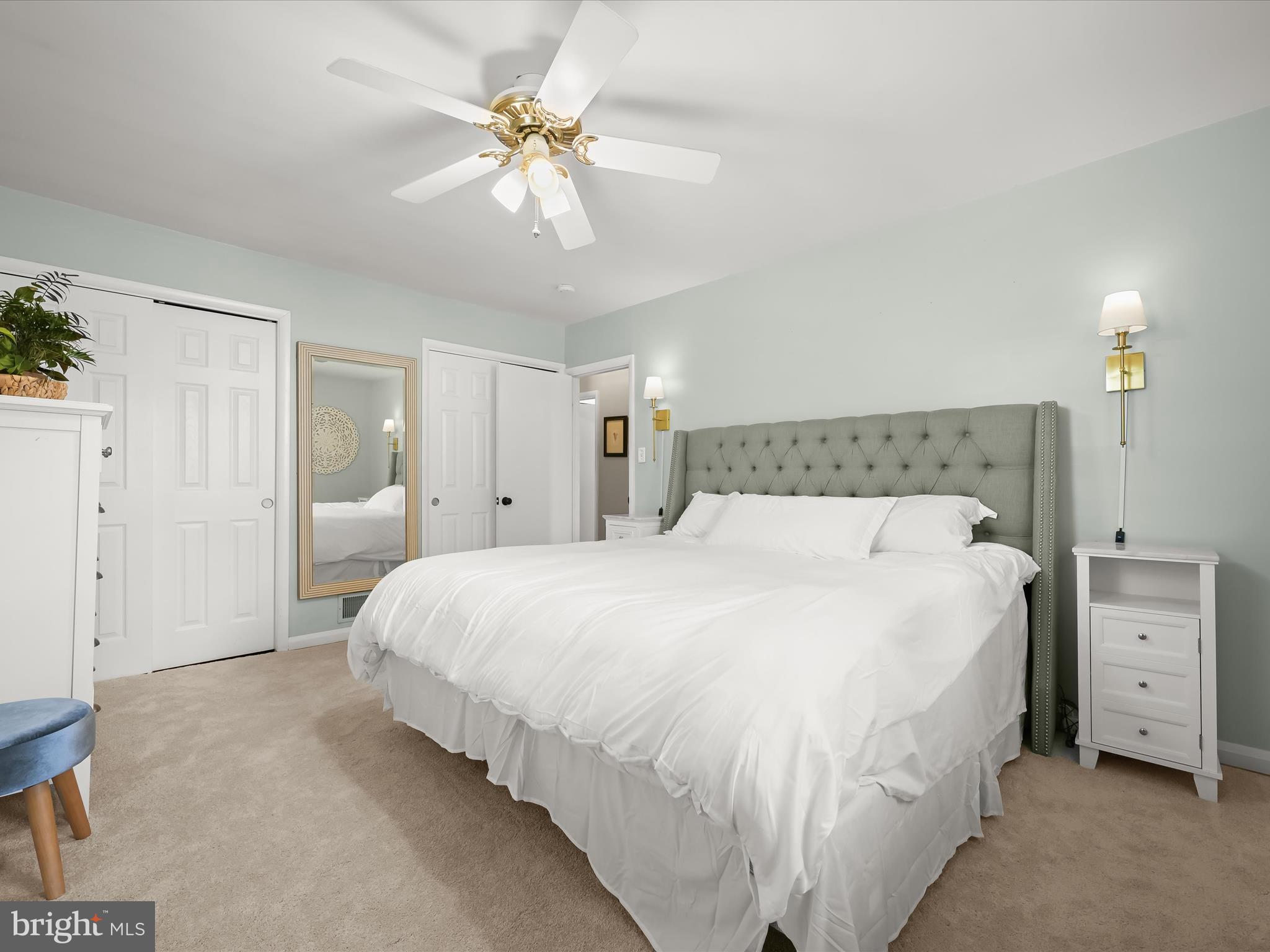 1910 Rollingwood Road Catonsville, MD 21228 - Photo 20 of 40 a spacious bedroom with a bed and a chandelier
