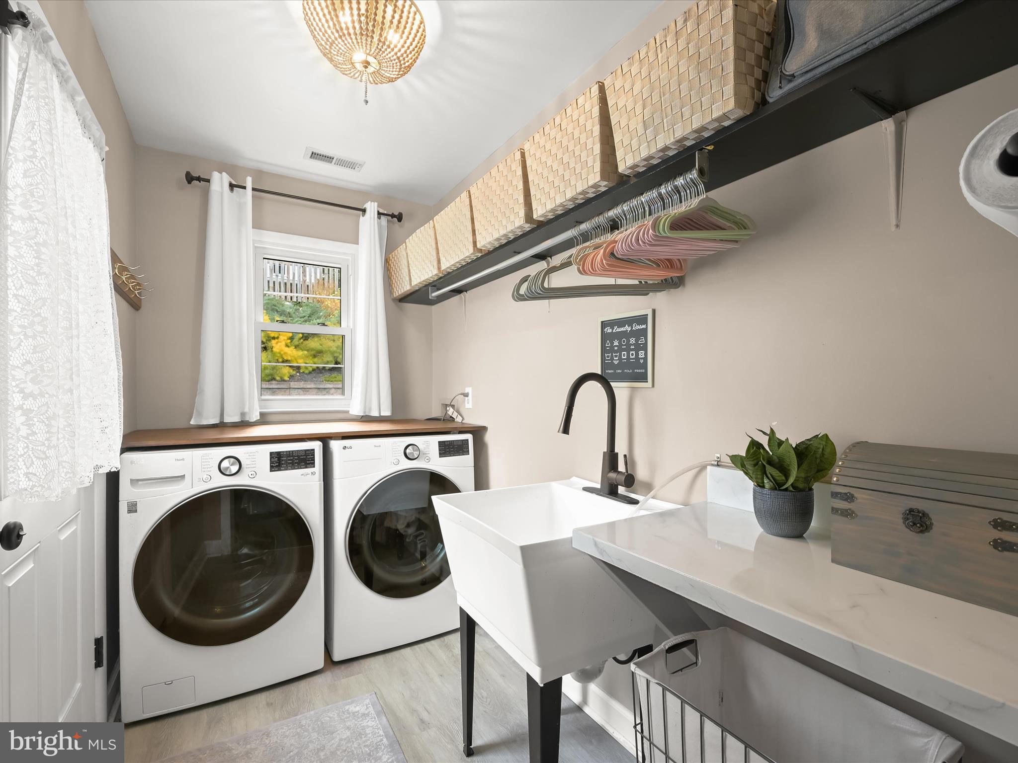 1910 Rollingwood Road Catonsville, MD 21228 - Photo 30 of 40 a utility room with sink dryer and washer