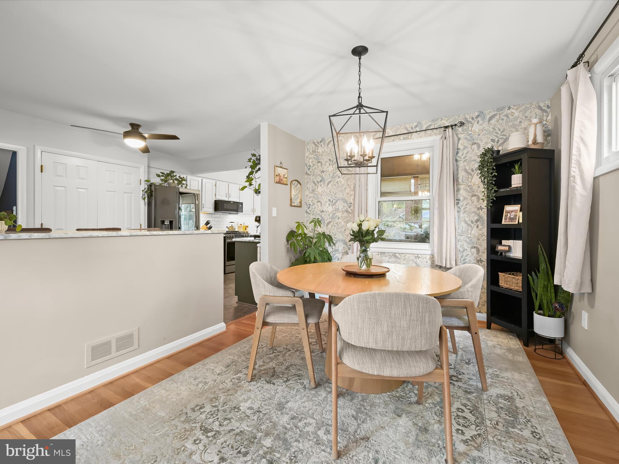 1910 Rollingwood Road Catonsville, MD 21228 - Photo 10 of 40 a view of a dining room with furniture window and wooden floor