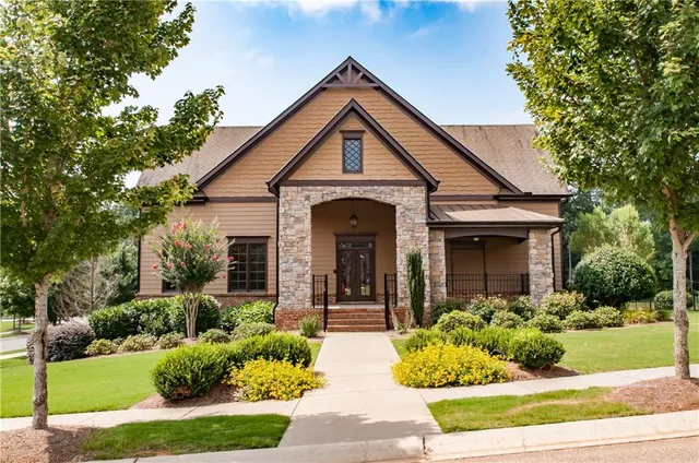 a front view of a house with garden