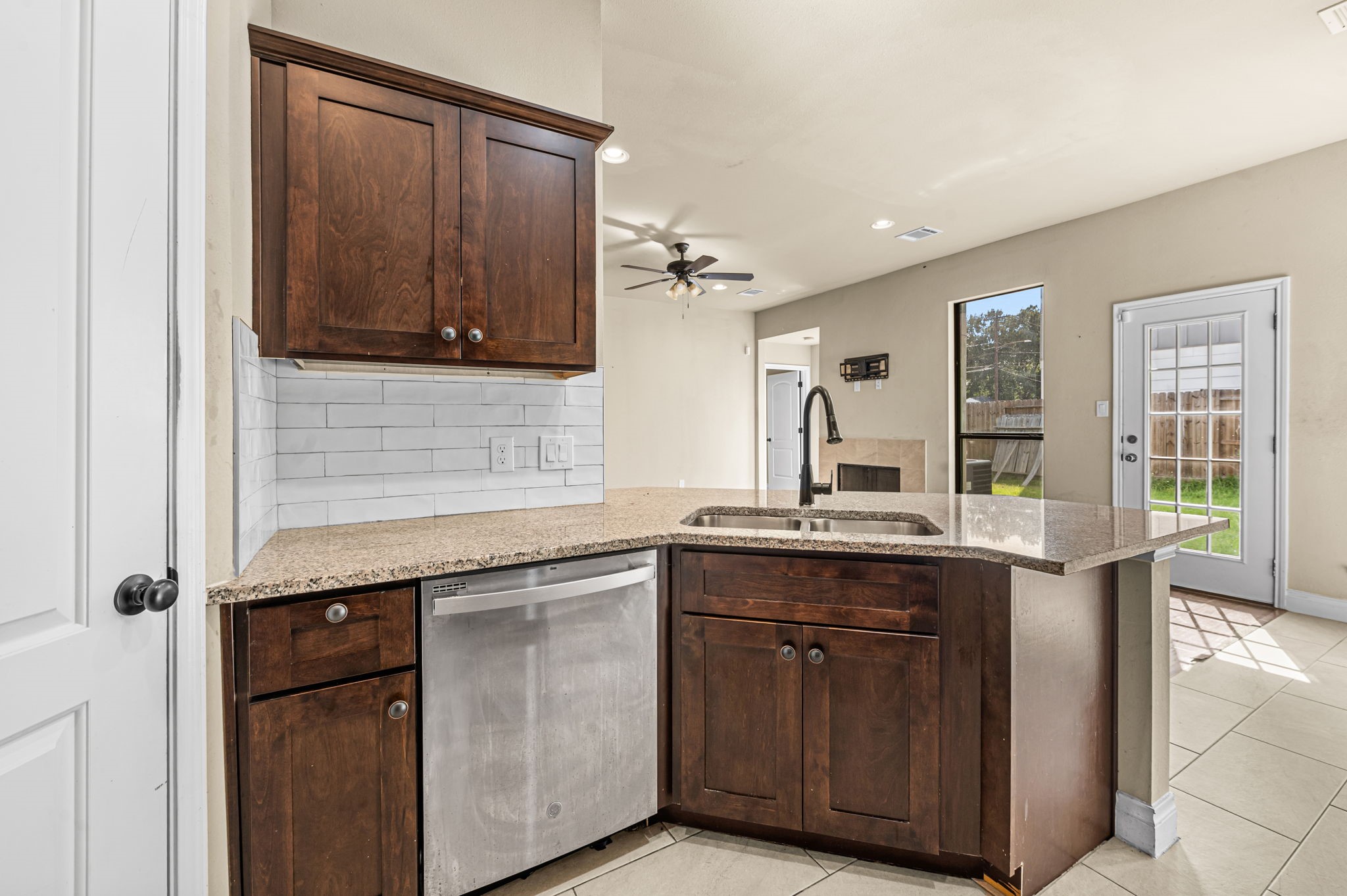 6838 Foster Street Houston, TX 77021 - Photo 11 of 24 Additional kitchen view highlighting ample cabinetry, counter space, and a stainless steel dishwasher