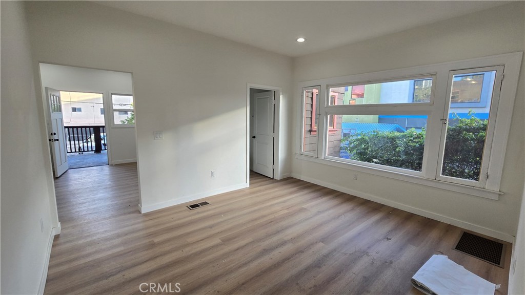 1036 Beacon Avenue, Unit 1036 Los Angeles, CA 90015 - Photo 5 of 7 wooden floor in an empty room with a window