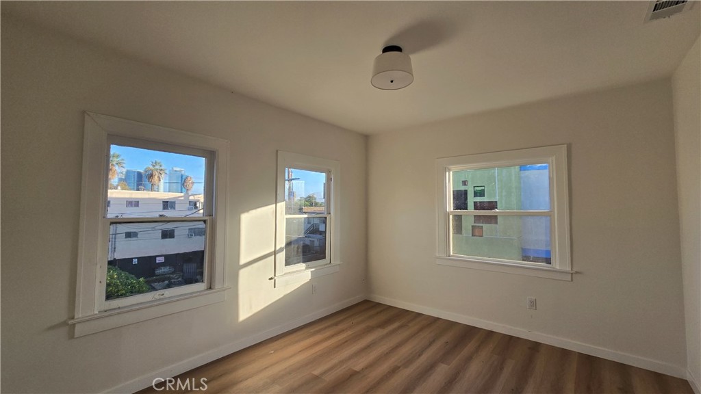 1036 Beacon Avenue, Unit 1036 Los Angeles, CA 90015 - Photo 7 of 7 a view of an empty room with a window