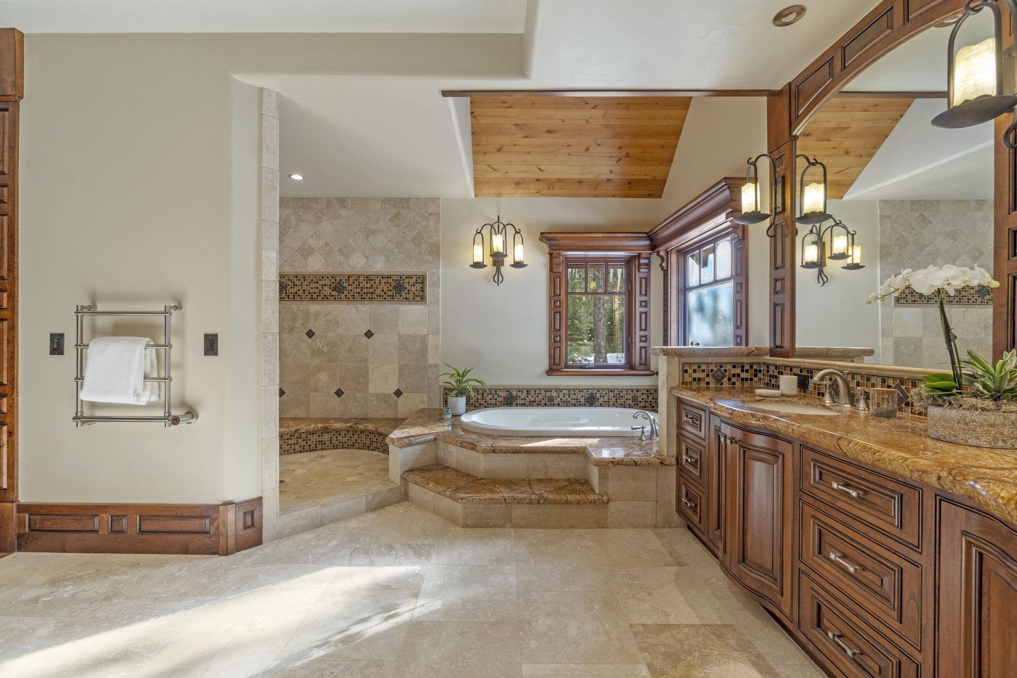 12541 Granite Drive Truckee, CA 96161 - Photo 11 of 20 a spacious bathroom with a tub sink and mirror