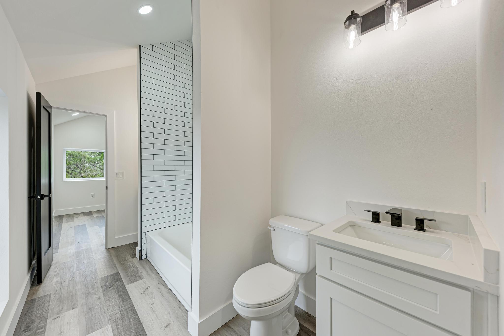 4190 West Fm 243 Bertram, TX 78605 - Photo 27 of 42 Jack n' Jill bathroom upstairs main home