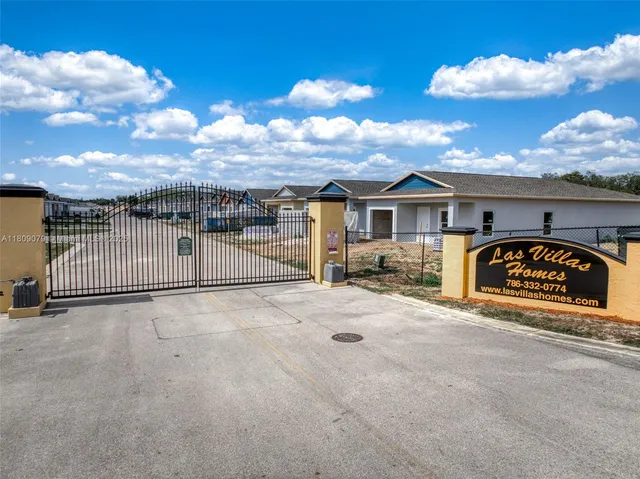 a view of a swimming pool with a yard