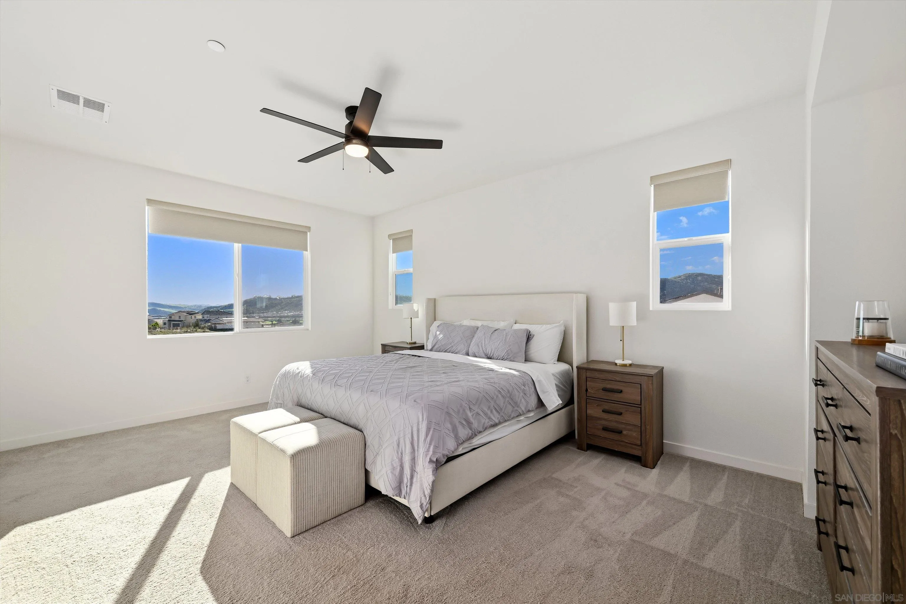 35158 Orchard Trail Fallbrook, CA 92028 - Photo 14 of 40 a spacious bedroom with a bed and a window