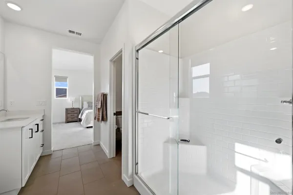 a bathroom with a double vanity sink and mirror