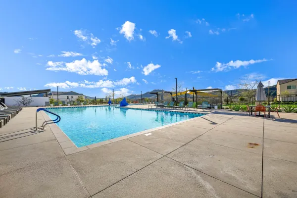 a view of a patio with a table and chairs