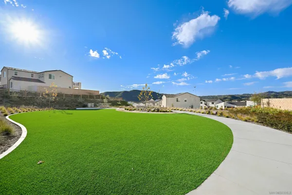 a view of a swimming pool with a yard