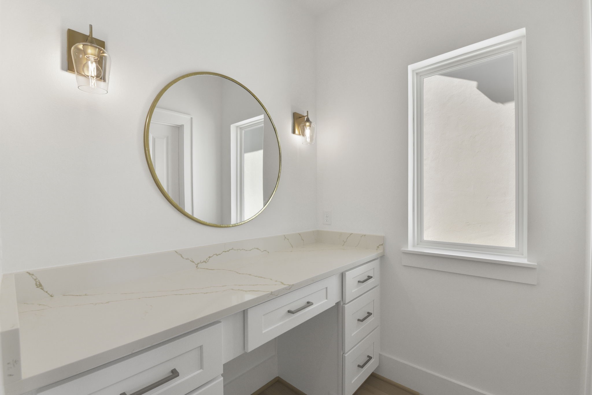 2916 Virginia Street Houston, TX 77098 - Photo 11 of 19 a bathroom with a sink and a mirror