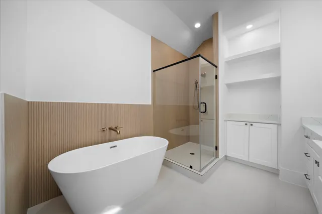 a bathroom with a bathtub and a shower