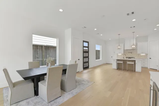 a view of kitchen with microwave and cabinets