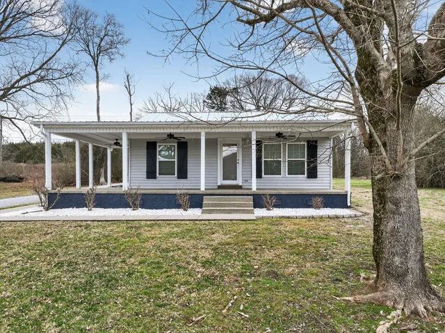 front view of a house with a yard