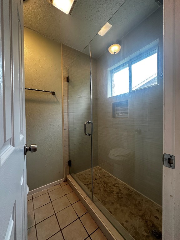 504 Suzzane Road Pflugerville, TX 78660 - Photo 12 of 15 a bathroom with a shower and a sink