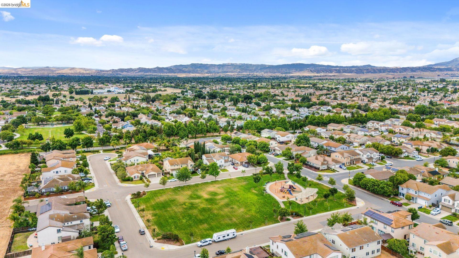 700 Brownstone Road Oakley, CA 94561 - Photo 5 of 58 Aerial perspective showcasing a residential neighborhood with a central green space