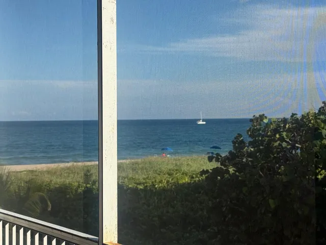 a view of a lake from a balcony