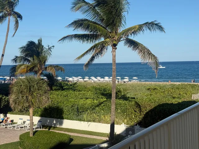 a view of a swimming pool and a yard