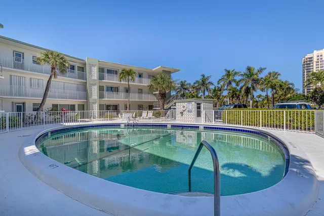 a view of a swimming pool with a patio