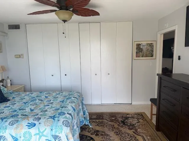 a bedroom with a bed and hallway