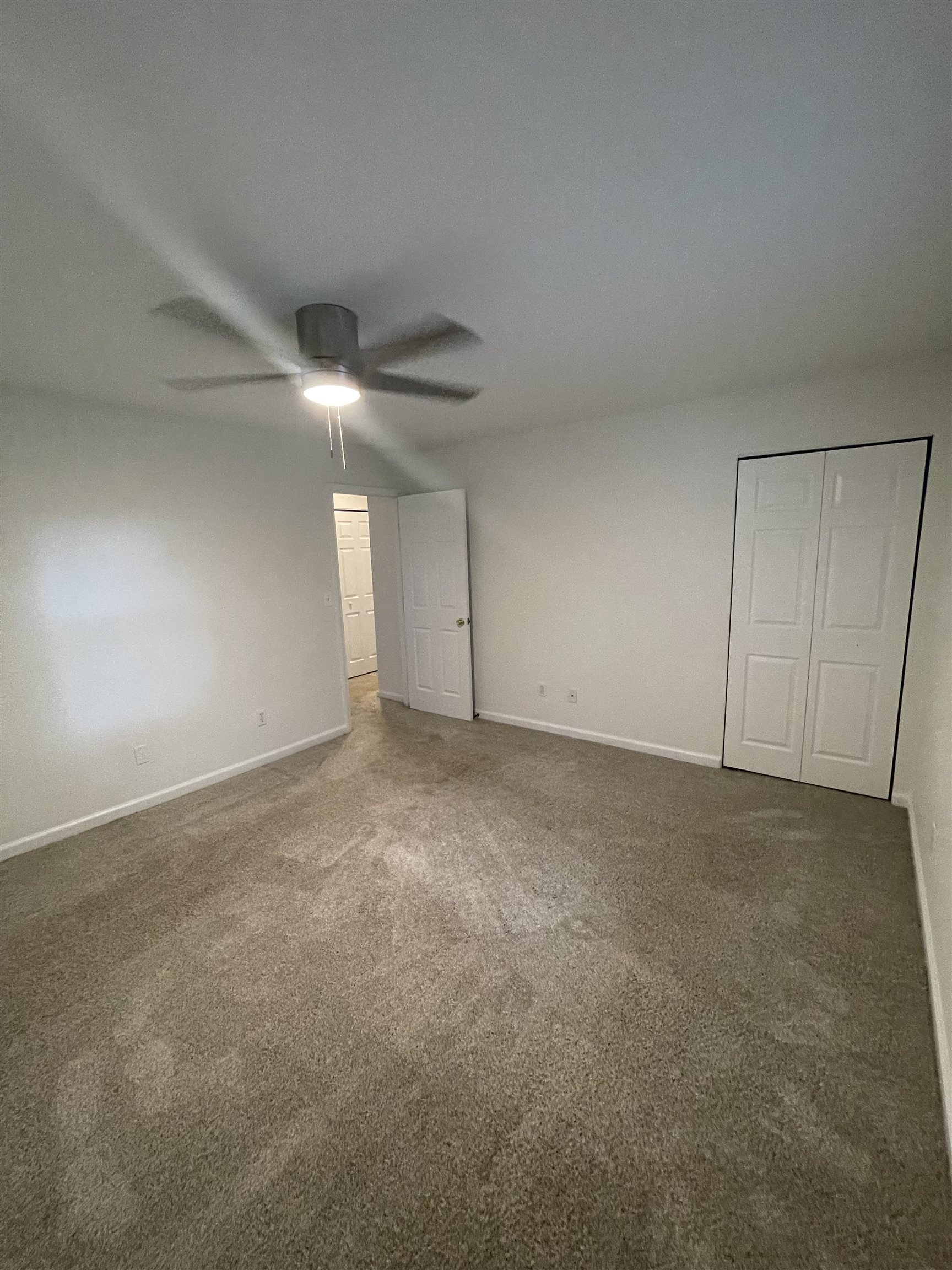 4420 Carter Road, Unit 60 St. Augustine, FL 32086 - Photo 11 of 14 a view of an empty room and a ceiling fan
