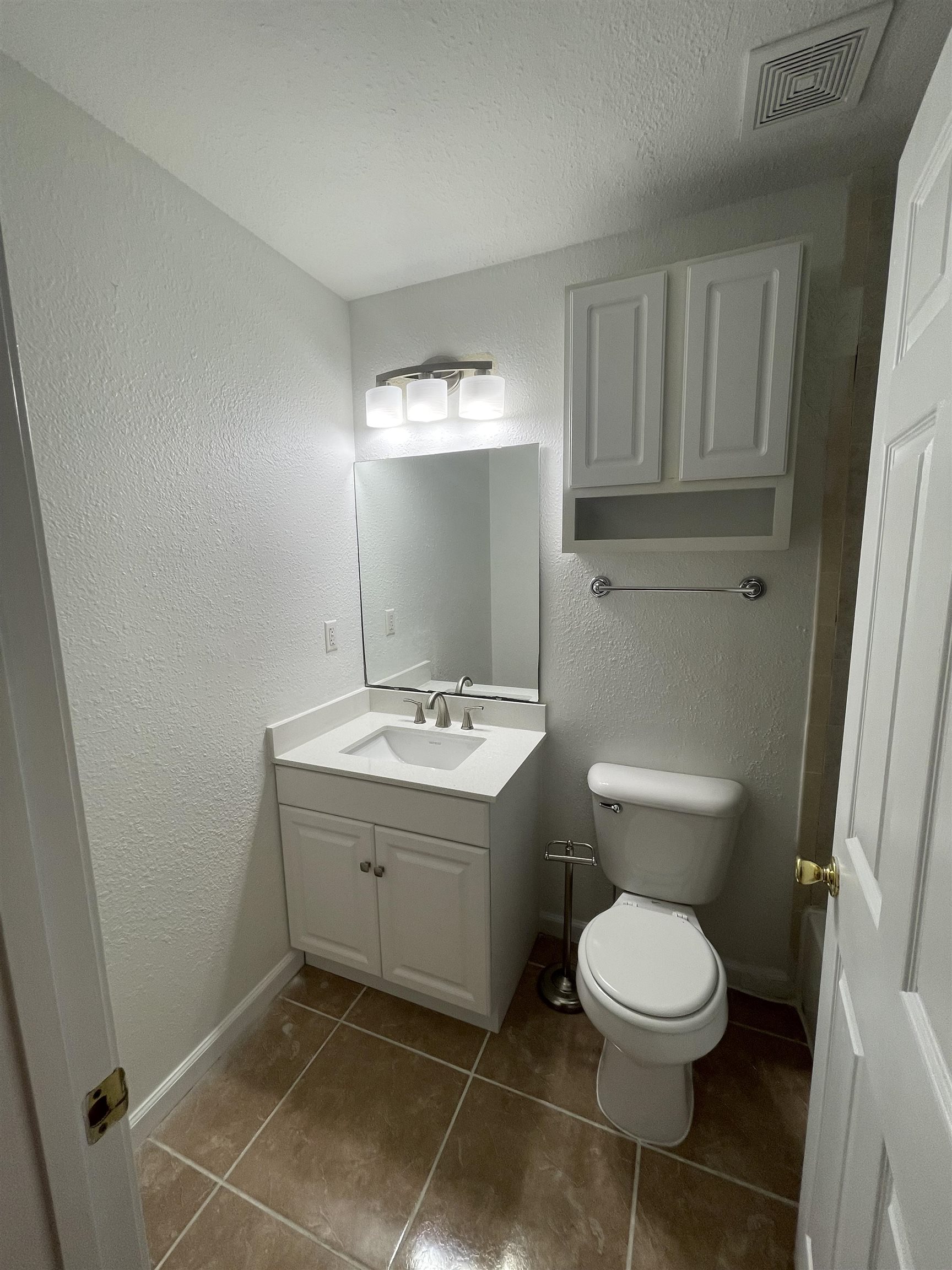 4420 Carter Road, Unit 60 St. Augustine, FL 32086 - Photo 8 of 14 a bathroom with a toilet sink and mirror