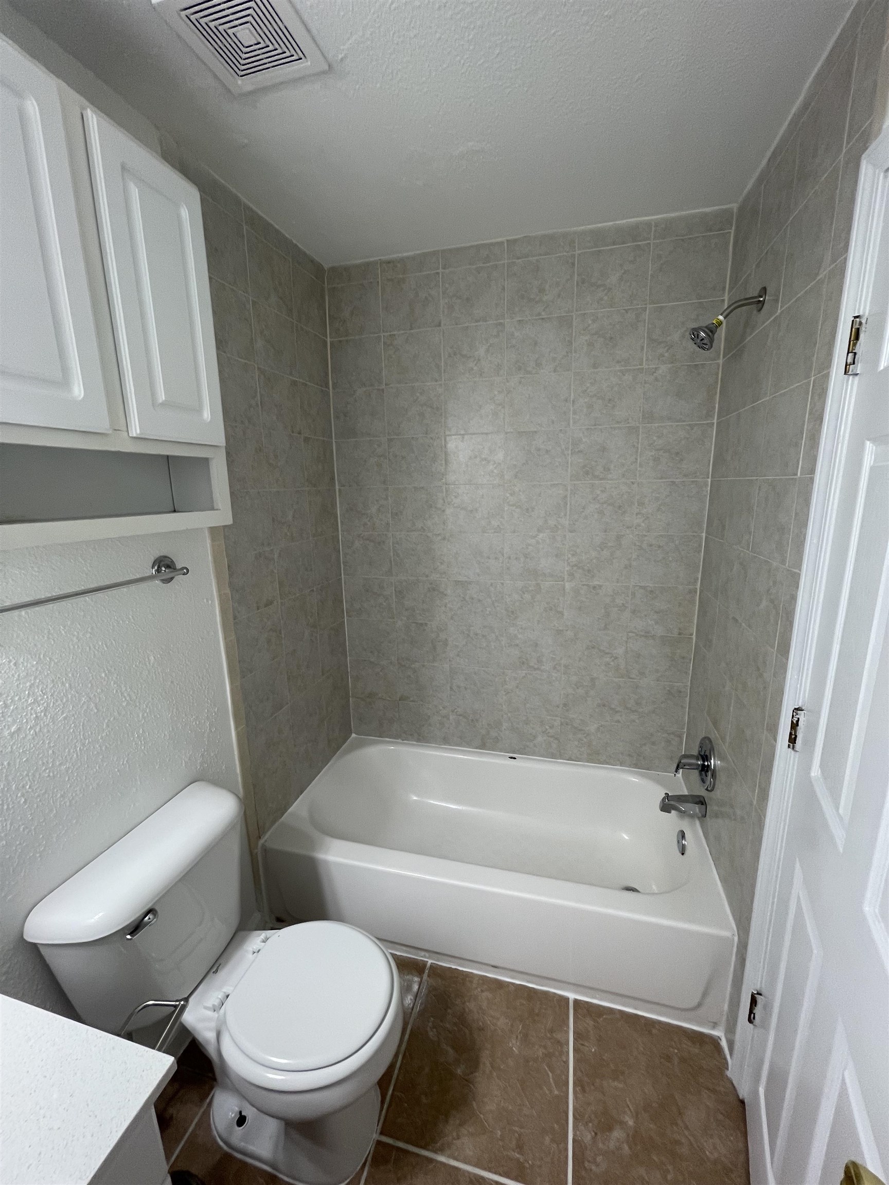 4420 Carter Road, Unit 60 St. Augustine, FL 32086 - Photo 9 of 14 a white bath tub sitting next to a toilet