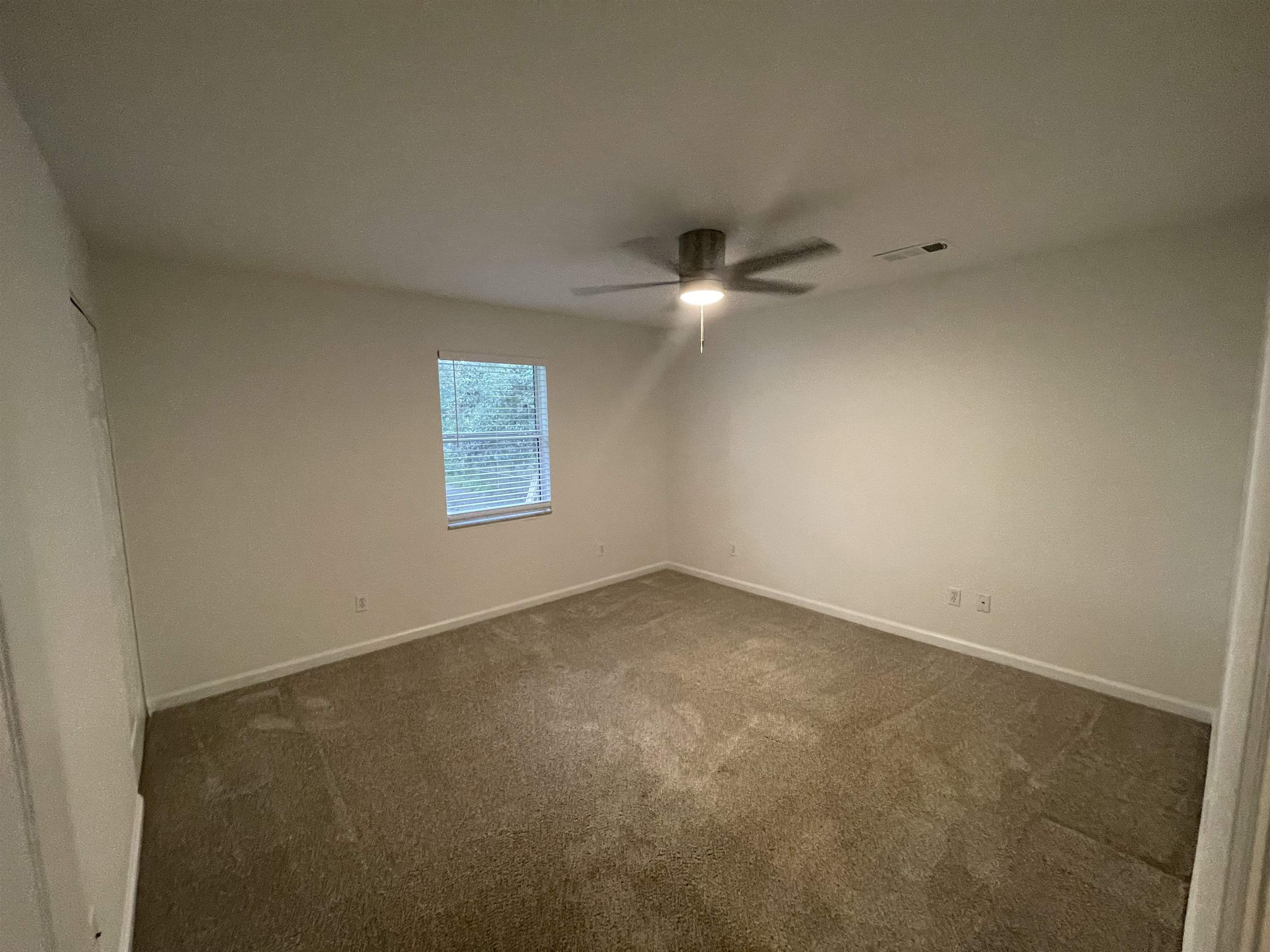 4420 Carter Road, Unit 60 St. Augustine, FL 32086 - Photo 10 of 14 an empty room with a window